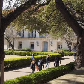 main-mall-through-trees-with-students-and-battle-hall-