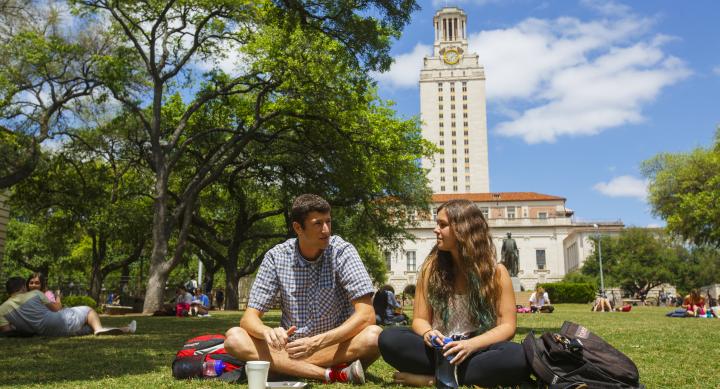 Students sitting in front of UT tower